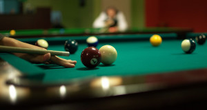 player setting up a shot billiards/pool standard equipment billiard balls