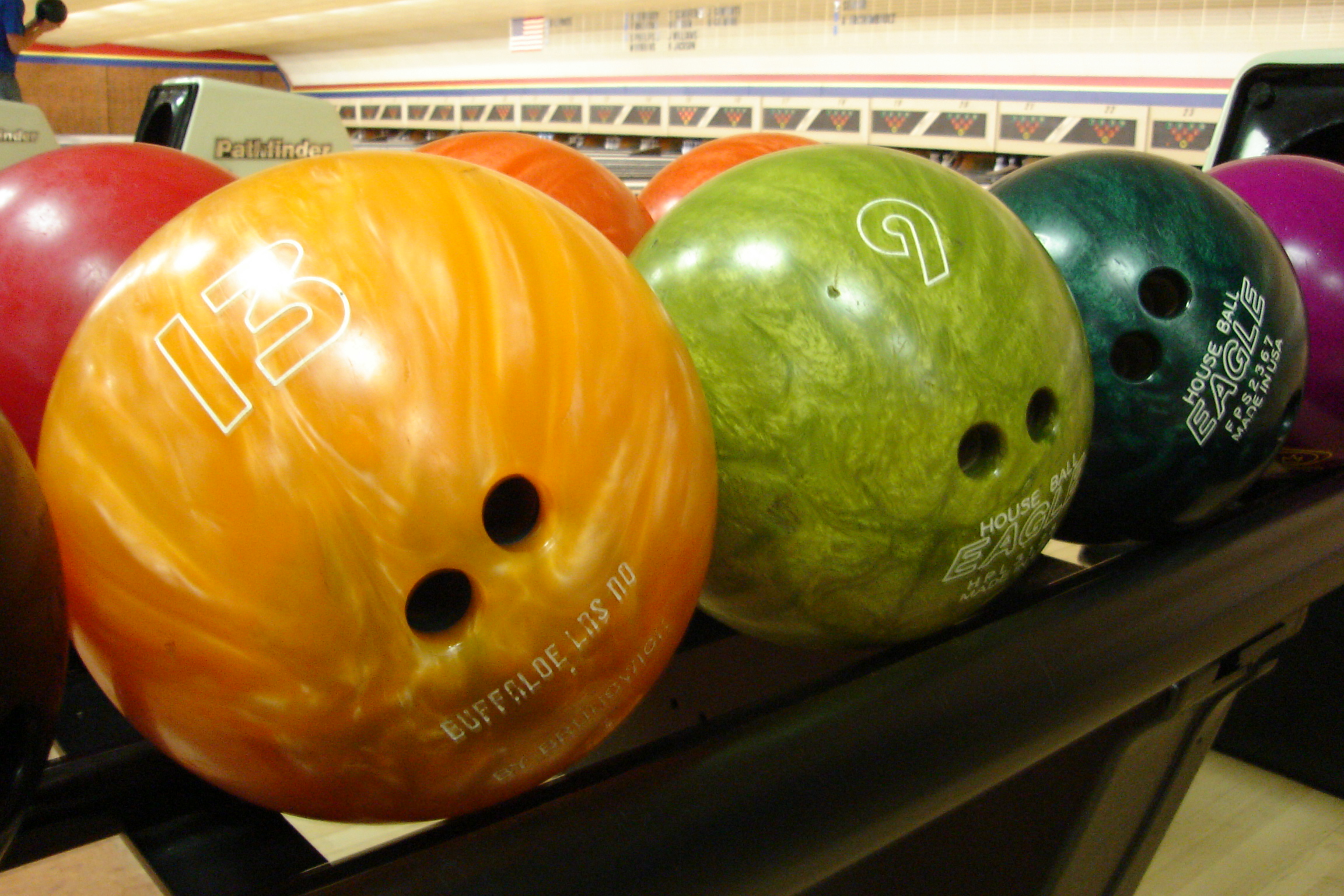 bowling balls on ball holder multiple colors of balls standard sizes for bowling balls
