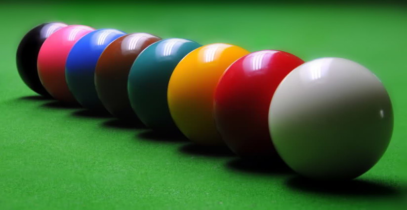 a row of snooker colored snooker balls white ball red ball orange ball green ball maroon ball blue ball pink ball black ball basic equipment for snooker ball