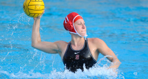 woman throwing regulated water polo ball with red cap and black sport bathing suit