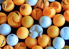 mixture of white and orange table tennis balls some are smashed and some are not basic equipment for table tennis ping ping balls