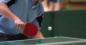 table tennis player about to hit a ping pong ball basic equipment for table tennis/ping pong ball a regulated ping pong ball