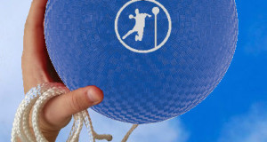 hand holding blue angle ball ball with angle ball logo in white on the side also holding a rope in same hand basic equipment for angle ball angle ball ball