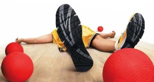 ad from dodgeball movie man laying on ground with view from under the soles of tennis shoes 4 red dodgeball balls basic equipment of dodgeball 4 red blocker balls 2 red stinger balls