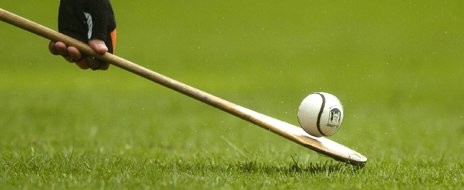 Hurling stick with ball on the end basic equipment