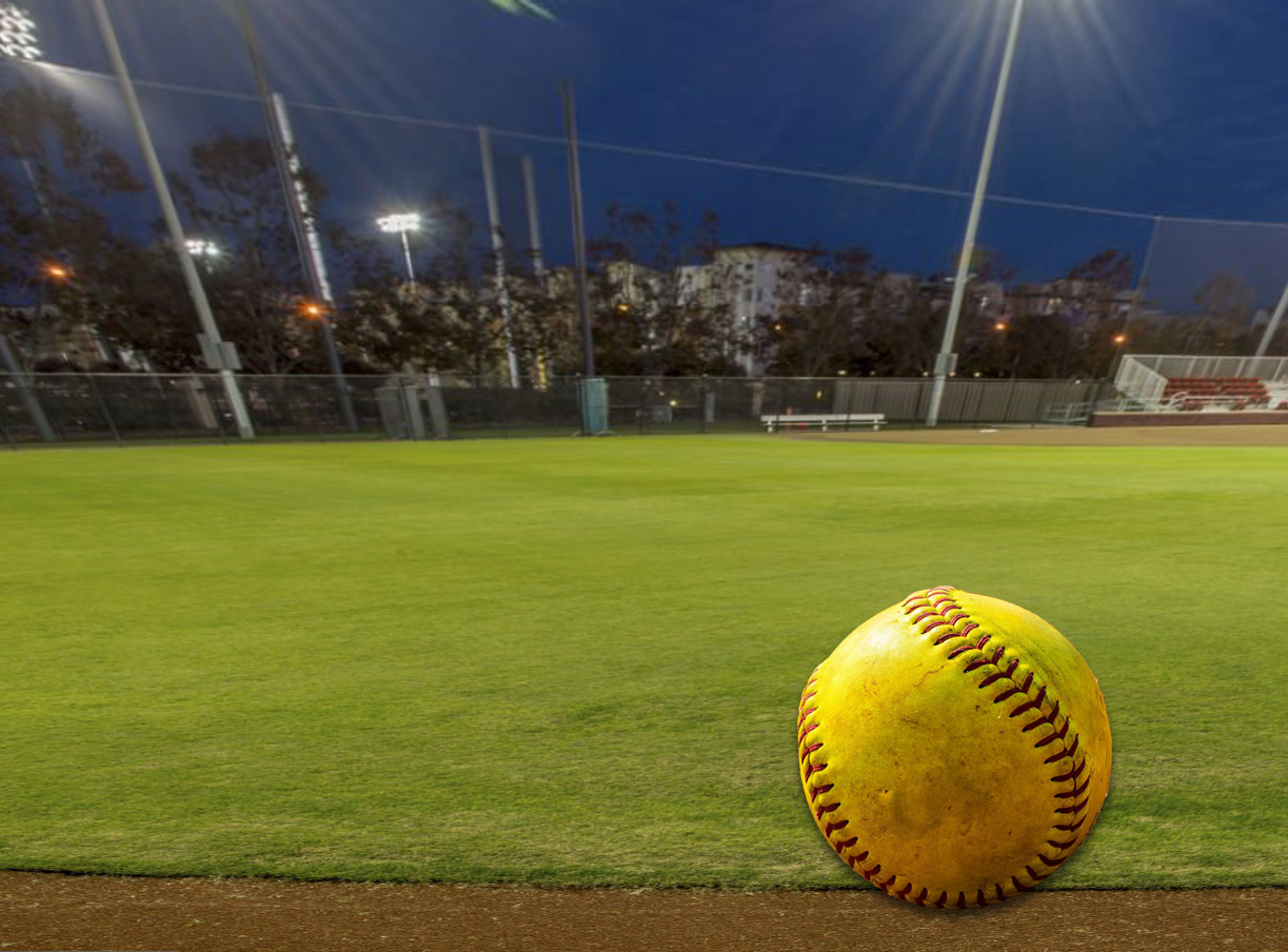 slow pitch softball at track in outfield
